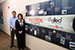 Atkore International's Scott Crumrine, director of capital projects, and Georgeann Rodgers, office service manager, are photographed with a sign denoting Atkore's history â€” which includes achieving a LEED-CS Gold certification at its facility in Harvey, Ill., last year.