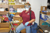 
Stacie Abold, custodial leader at Chadron State College, gears up with personal protective equipment prior to handling pests. 
