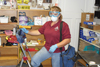
Stacie Abold, custodial leader at Chadron State College, gears up with personal protective equipment prior to handling pests. 
