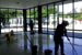 Janitors working for Building Professionals of Texas Janitorial Service, in Houston, work on flooring in an industrial facility.
