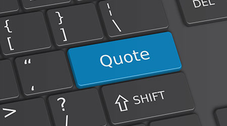 A keyboard with the word "quote" written on the enter or return button