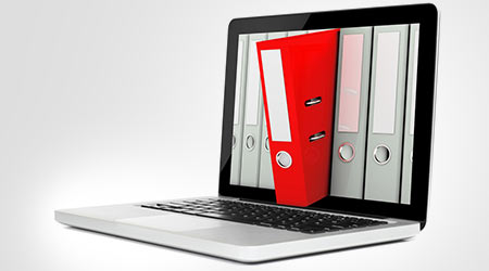 Laptop with red ring binders