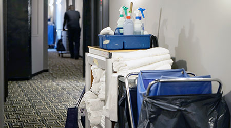 Cleaners trolley with cleaning equipments at hotel