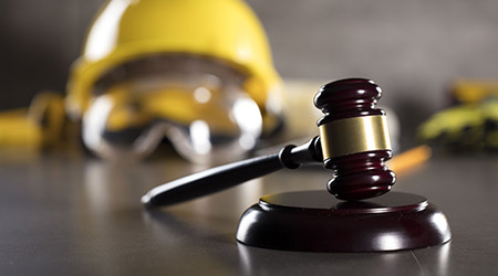 Construction hat next to gavel