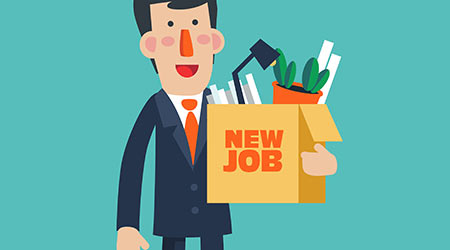 Successful smiling young business man holding a box with her things with inscription " New job".