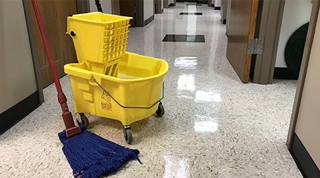Janitors cleaning mop and bucket