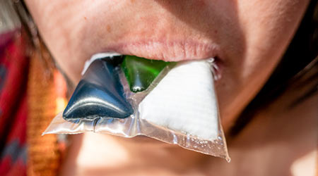 girl eating laundry detergent in Tide Pod Challenge