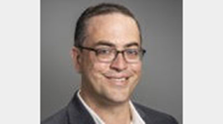 Man in glasses smiling