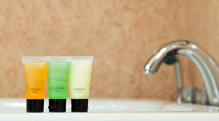 Set of toiletries placed at sink in the bathroom