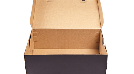 Open black cardboard box with lid isolated on white background