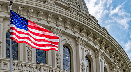 American flag flying in front of U.S. Capitol Building