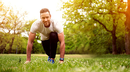 Fit man exercising in a park
