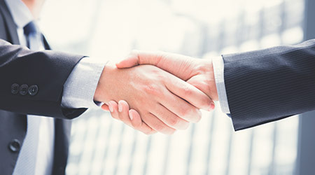 Businessmen making handshake - greeting, dealing, merger and acquisition concepts