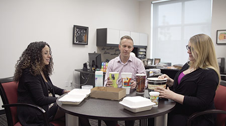 Marianne Abiaad talks business with Rob Mouw and Anna Lemus
