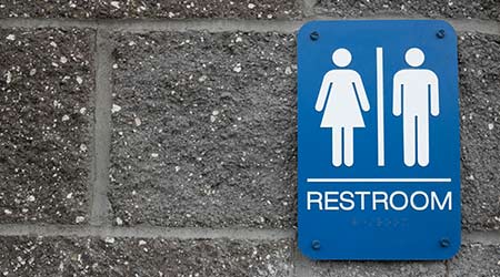 toilet wc restroom sign men and woman icon graphic on wall