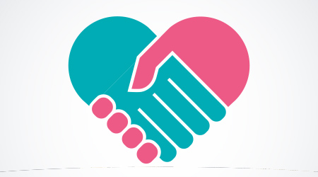 pink and blue hands joined together to form a he