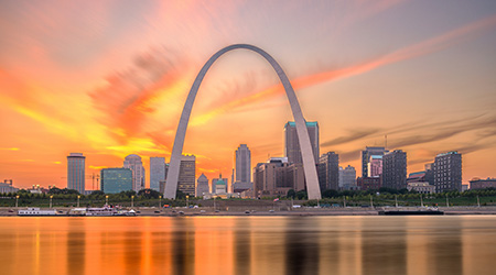 St. Louis, Missouri, USA downtown cityscape on the river at dusk.