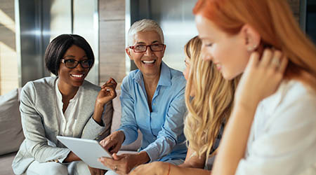 Happy business women smiling