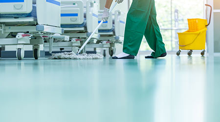 Cleaner using mops, cleaner with mop and uniform cleaning hall floor, hospital cleaning floor with mop in patient room the hospital epoxy floor.