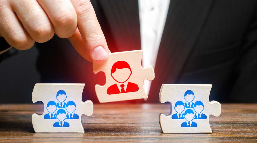 A businessman appoints a leader to the head of the team. Creation of an effective teams of specialists for the implementation of a new project. HR recruiting. Management appointment.