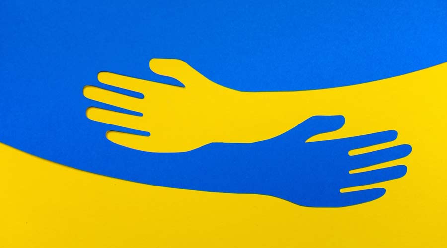 Support for Ukraine. Embrace icon, arms hugging in colors of Ukraine , War in Ukraine, attack from Russia. Papercut, hands hug linear vector logo template. Care, love and charity symbol, hand papercut
