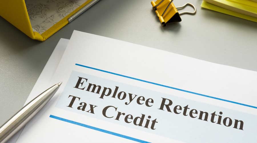 Employee retention tax credit papers and folder.