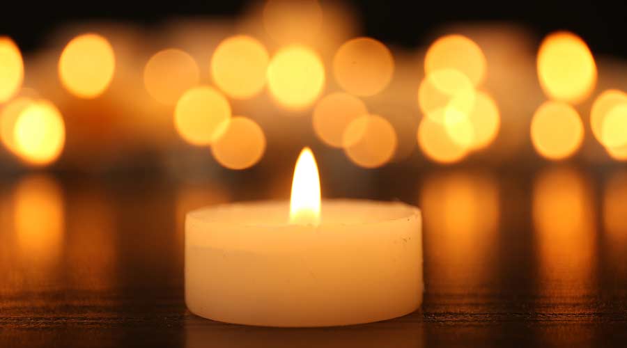 Burning candles on dark background