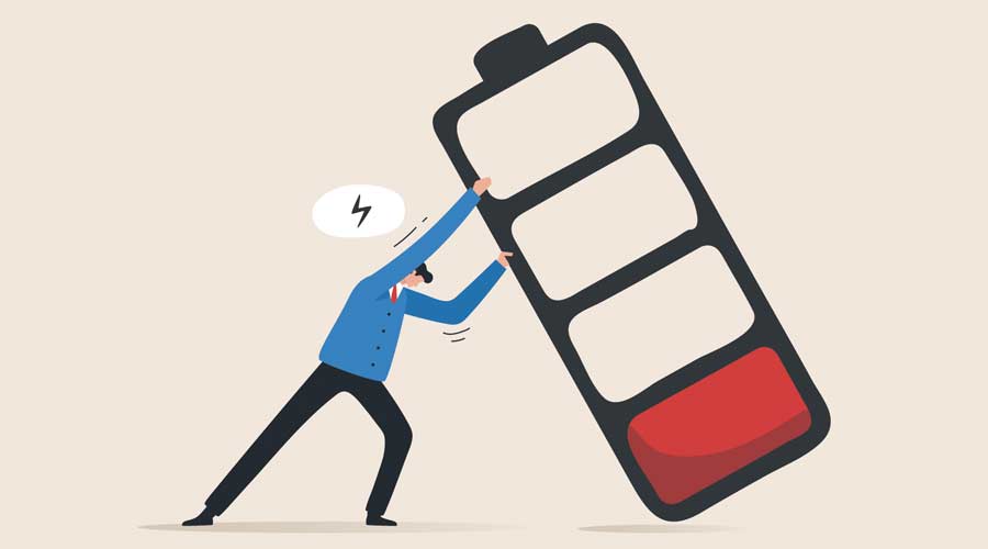 Recharge energy yourself. Fight burnout at work. Intolerance to burnout syndrome. Employees tried to prevent a large battery from falling over it.
