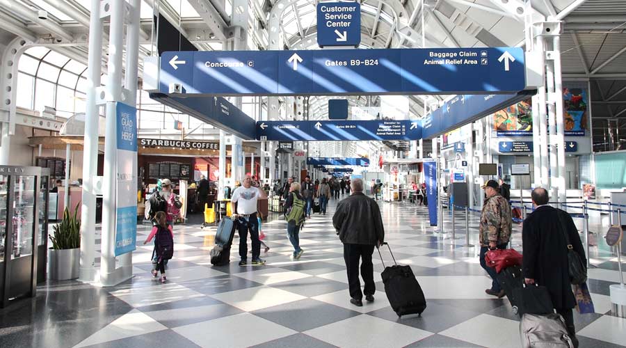 CHICAGO, USA - APRIL 1, 2014: Travelers walk to gates at Chicago O'Hare International Airport in USA. It was the 5th busiest airport in the world with 66,883,271 passengers in 2013.