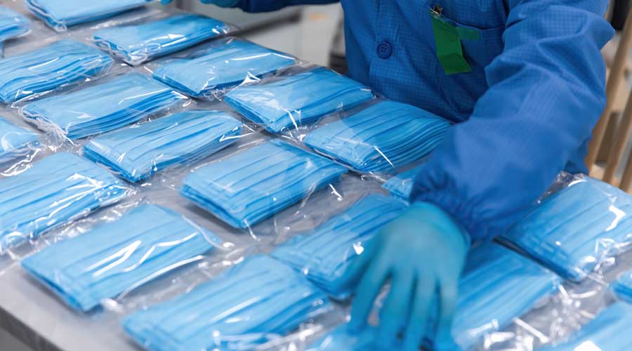 With the global spread of novel coronavirus pneumatia, medical mask production workers are organizing masks to prepare for the epidemic.COVID-19 outbreak