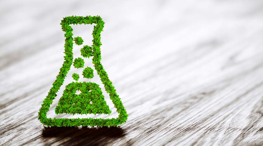 Green chemistry industry sign on black wooden background. 3D rendering.