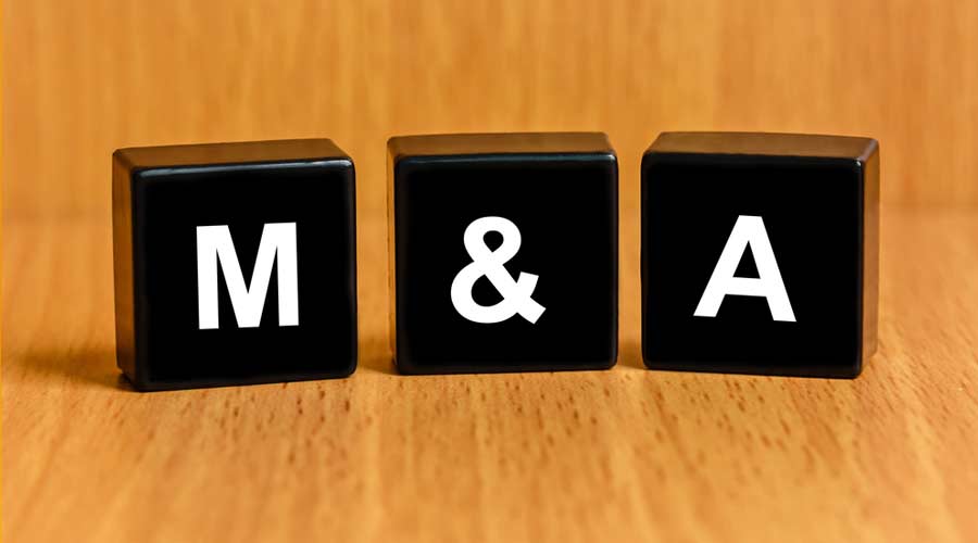 M&A or Merger and Acquisition text on black block