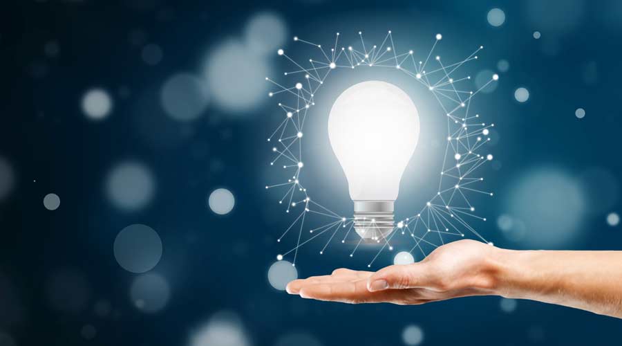 Businessman holding light bulb. Idea concept