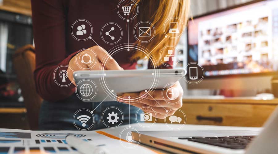 businesswoman hand working with laptop computer, tablet and smart phone in modern office with virtual icon diagram at modernoffice in morning light