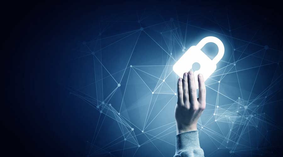 Hand of businessman on dark background with security glowing sign