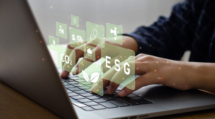 Young man sitting using a computer to analyze ESG, environment, conservation, society, governance, close to the computer screen in business investment strategy concept.