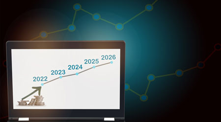 Arrow upwards on stack of coins and 2022 to 2026 growth graph on computer laptop. Return on investment ROI concept and making money with saving idea. Uptrend and bull market