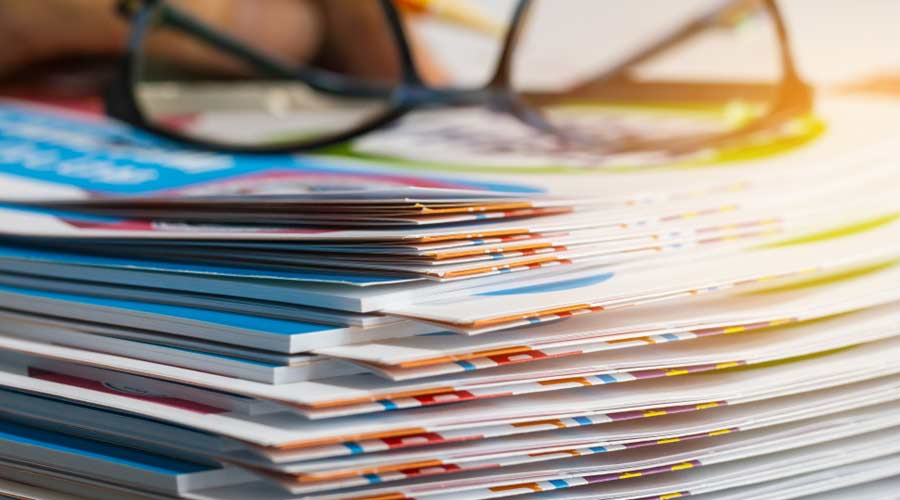 Stack of report paper documents for business desk with glasses, Business papers for Annual Reports files, Document is written,presented. Business offices concept, soft focus