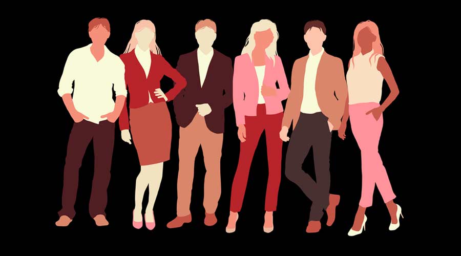 a group of people standing on a dark background