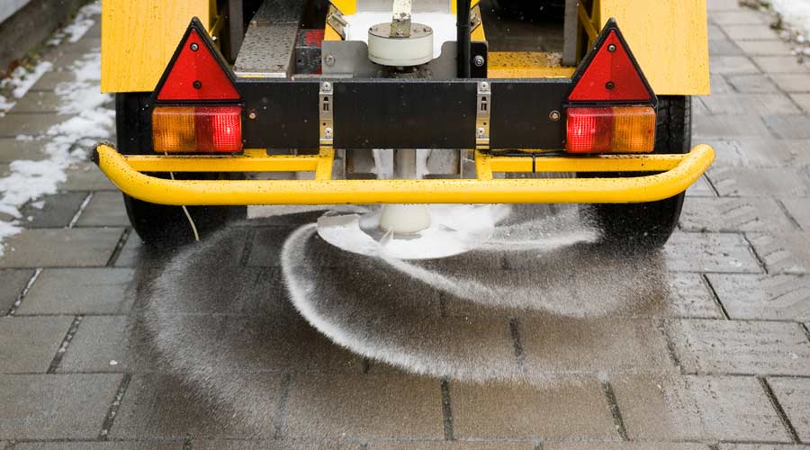ice melt being applied