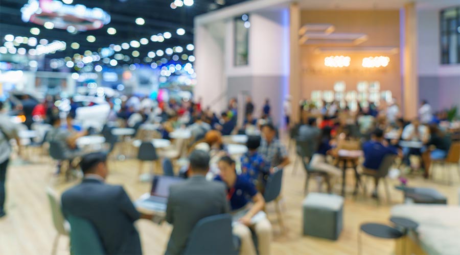 Abstract blurred defocused tradeshow event exhibition, business convention show, job fair, technology expo. Organization company trade fair event. Marketing advertisement concept