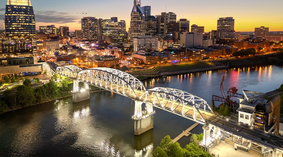 Nashville, Tennessee, USA skyline over the Cumberland River at golden hour