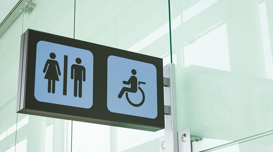 Public restroom signs with a disabled access symbol