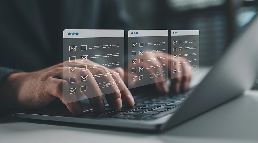 Online survey and assessment concept with person filling digital forms on laptop. Ideal for e-learning, feedback systems, data collection, market research and remote evaluations
