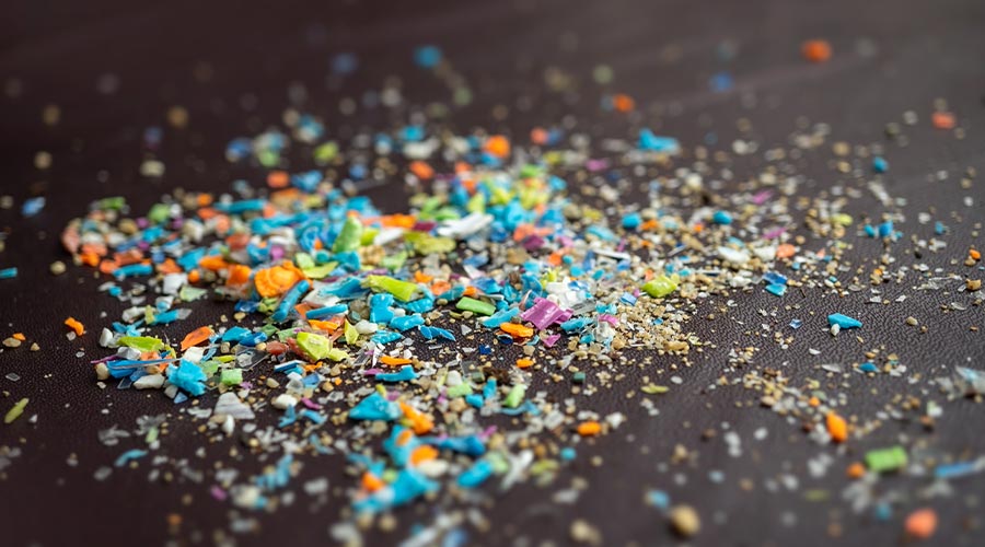Close-up on a pile of micro plastic particles. Concept for water pollution and global warming. Macro shot on a bunch of microplastics that cannot be recycled