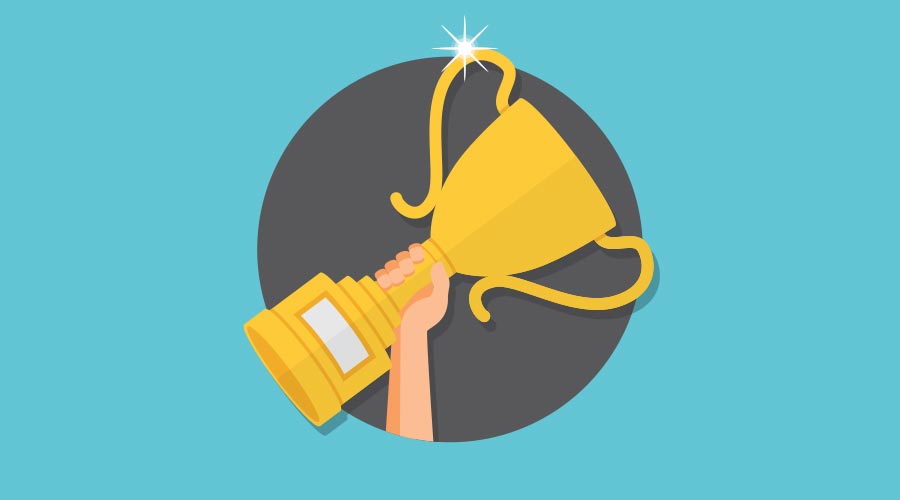 First place finish with hand holding up trophy.