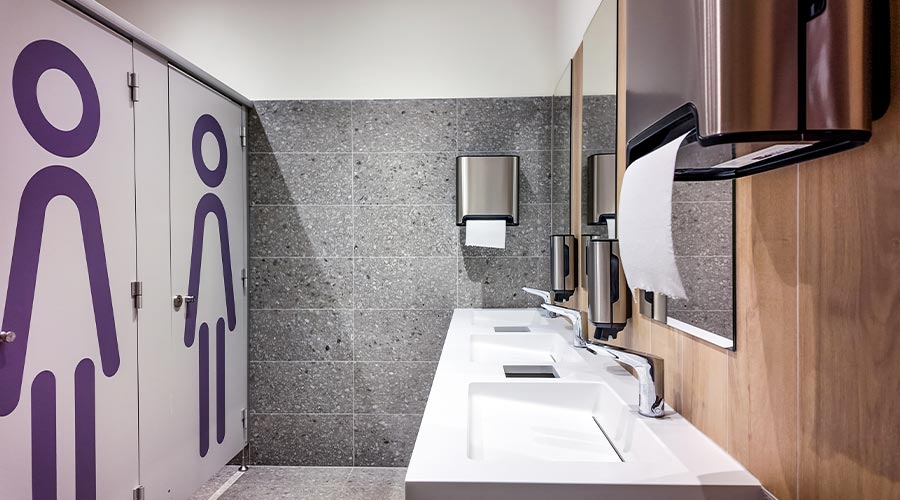 Modern public restroom with clean sinks and facilities, emphasizing hygiene, accessibility, and cleanliness, suitable for travel and public spaces