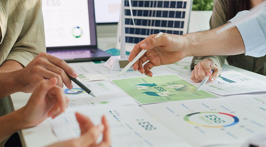 Closeup group Asia businesspeople talk ESG strategies risk management workshop, SDGs report, global warming, green finance investment eco friendly and net zero waste in boardroom training building.