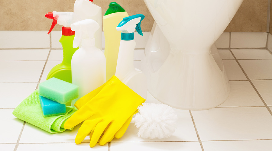 cleaning items gloves brush white toilet bowl bathroom