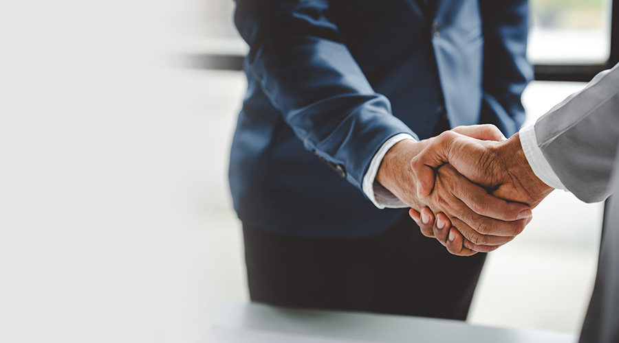 business partner handshake concept Colleagues shaking hands Successful deal after a great meeting. Blurred background.